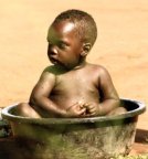 photo of child in washtub
